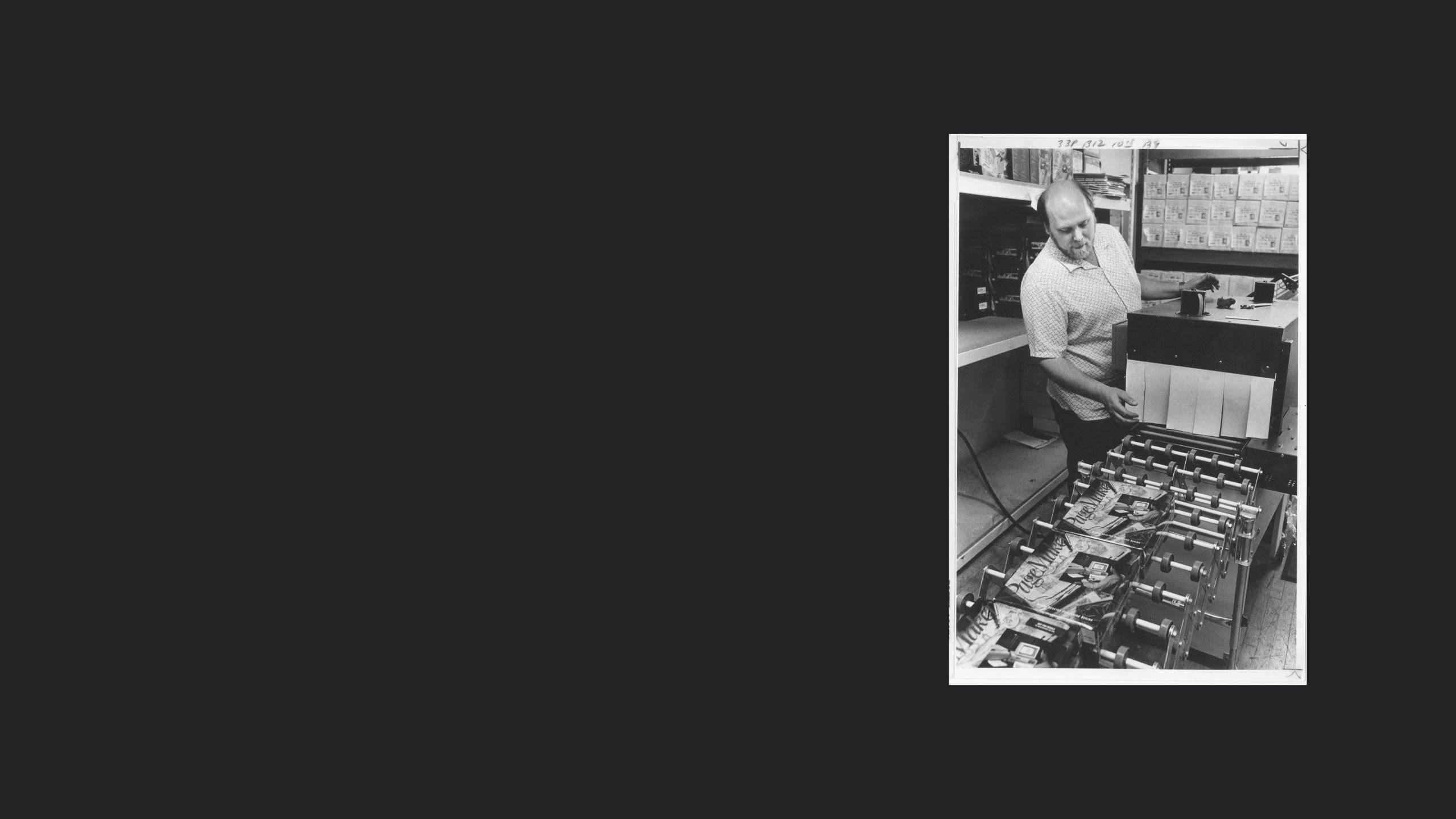 A person with software boxes.